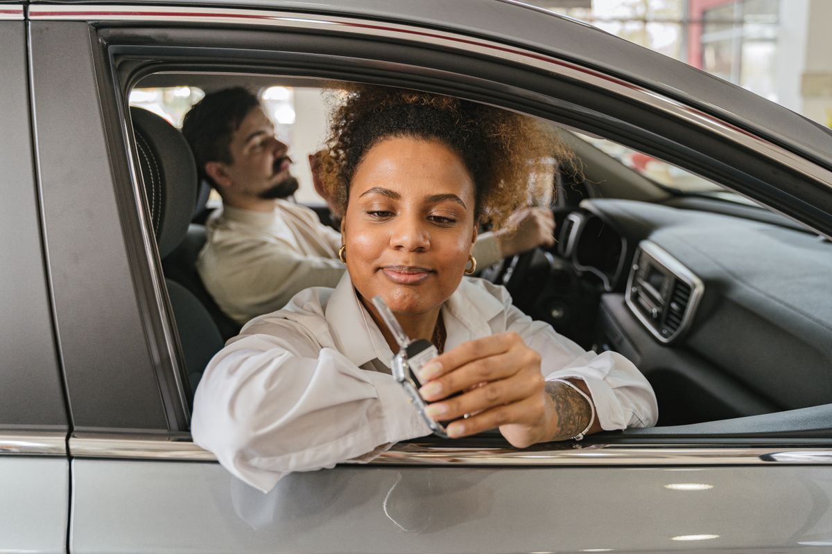 People in a car showing the car keys