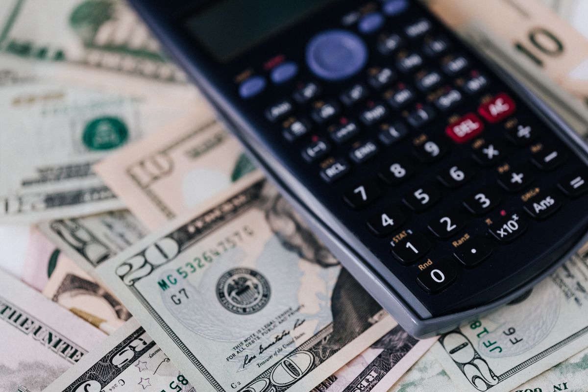 Calculator resting on banknotes